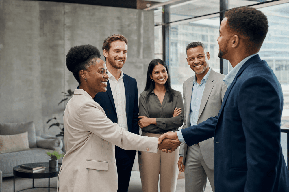 Diverse South African professionals welcoming a new executive hire
